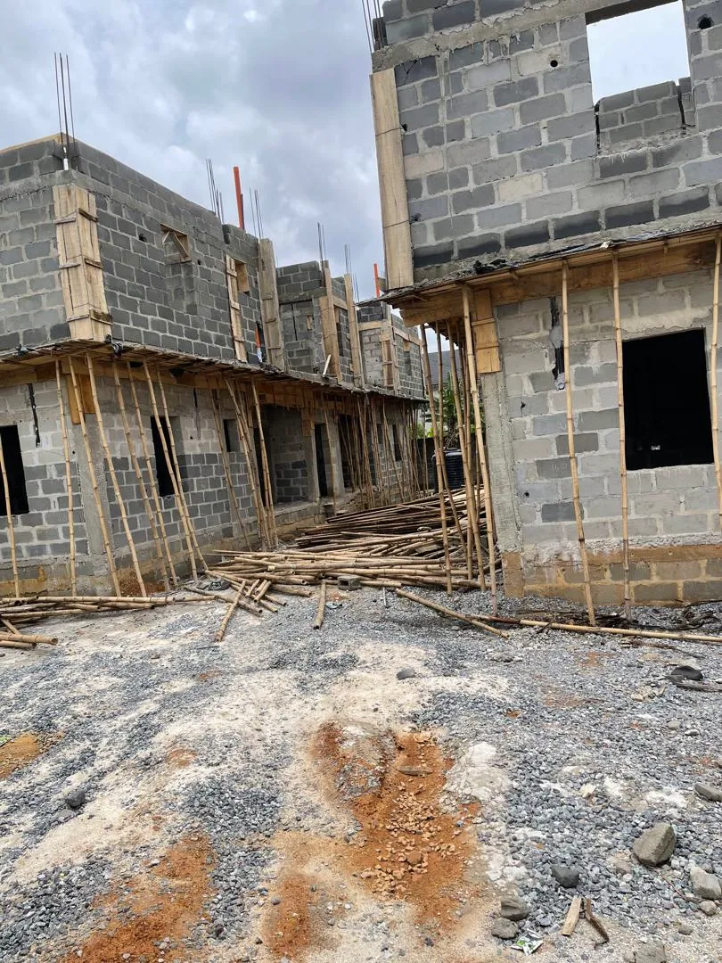 Structural steel members prepared for fabrication at a construction site.