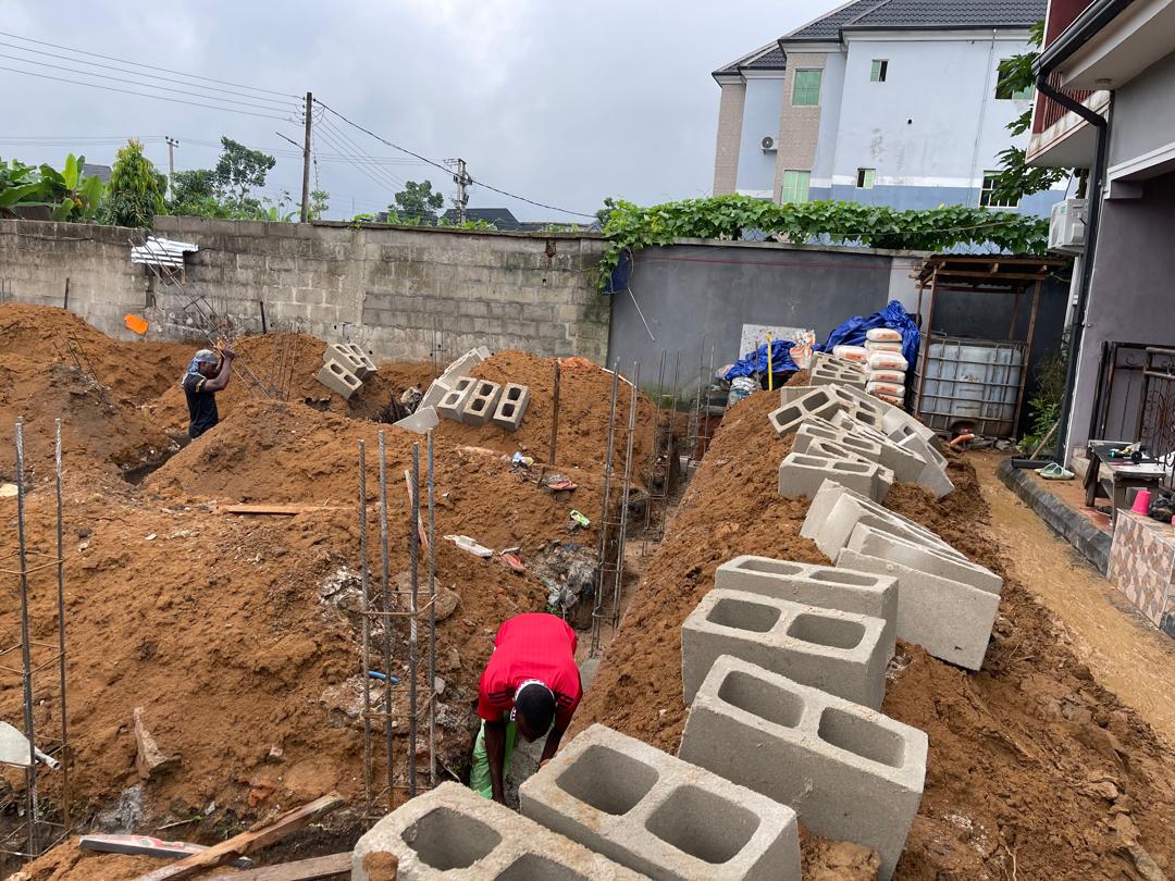 Reinforced concrete foundation and rebar works at a construction site.